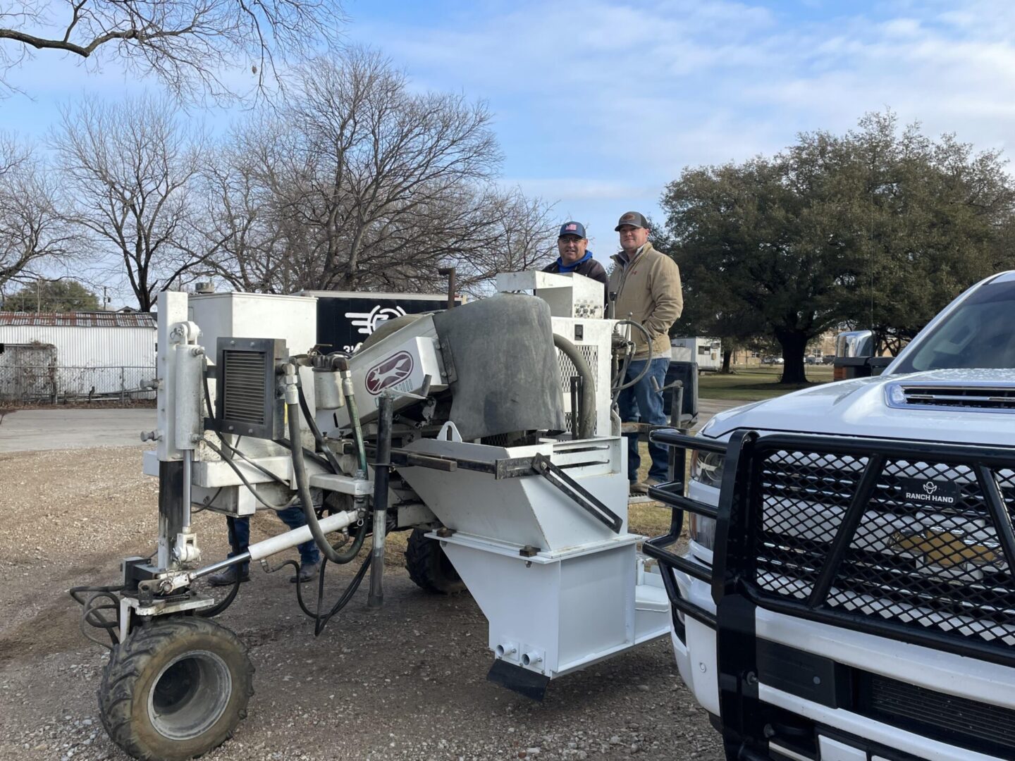 A man standing next to a large machine.