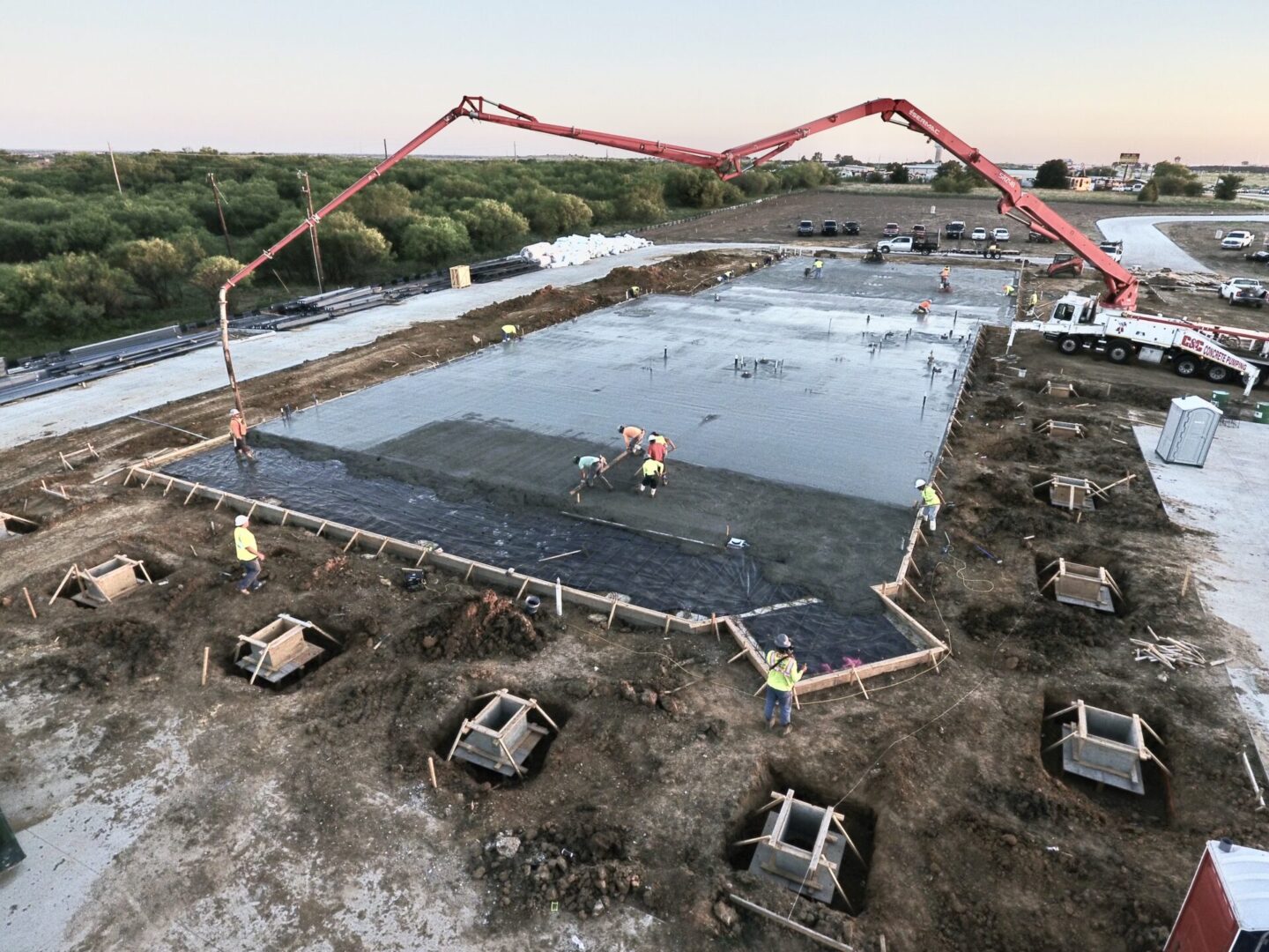 A construction site with cement blocks and water.