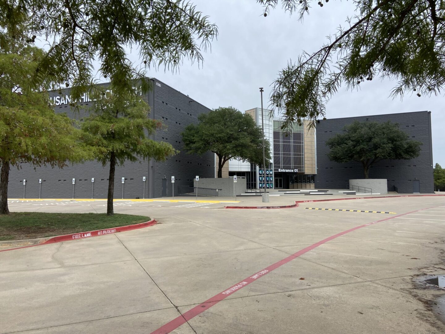 A large building with trees in front of it